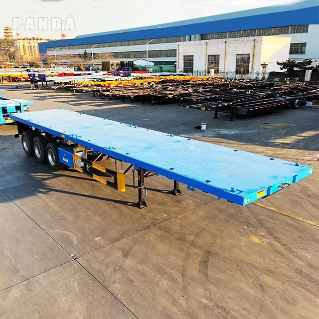 Heavy Duty Tri Axle Flatbed Trailer Configuration in Industrial Setting